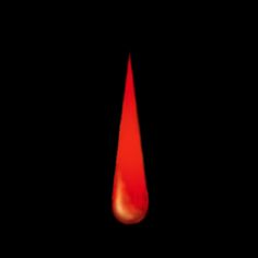 a blood drop in the dark with red light coming from it's end and black background