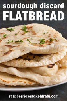 there are four flatbreads stacked on top of each other and the text reads sourdough discard flatbread