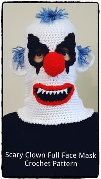 a crocheted clown mask with blue hair and red nose is featured in this photo