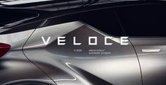 the back end of a silver vehicle that says veloce