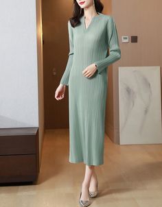 This versatile Pleated Long Sleeve Slim Fit Midi Dress can be dressed up or down to suit any situation. The lightweight fabric also lets you stay cool on a hot summer day. Winter Stretch V-neck Dress, Elegant Green V-neck Mini Dress, Stretch V-neck Winter Dress, Chic Green V-neck Sweater Dress, Winter V-neck Stretch Long Sleeve Dress, Elegant Green V-neck Long Sleeve Dress, Winter V-neck Stretch Dress, Green Long Sleeve V-neck Dress For Fall, Casual Solid Long Sleeve V-neck Dress