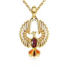 a gold necklace with an orange and white bird design on the front, surrounded by red stones