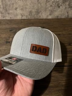 A gift any dad would love. Showing off his dad pride any chance he gets with his new custom dad hat.  Our hats are made with real leather patches and the highest quality hats. They can also be customized, just send us a message if you want to make any changes or personalize this hat for your dad. Girl Dad Hat, Leather Patch Hat, New Dad Gift, Patch Hat, Girl Dad, Fathers Day Presents, Dad Gifts, Gifts For New Dads, Quality Hats