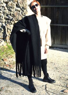 "Large over-sized wool wrap-around scarf with fringe ending, Chunky scarf, wool shawl wrap, winter scarf, warm and comfy, over-coat garment, black blanket , black scarf, meditation shawl for men and women Large oversized shawl wrap for women, wool knitted shawl, wrap in black, teal or black&white colors. This scarf is very soft and comfortable to wear, lightweight but very warm. You can wrap yourself this winter and it will keep you warm. It will be a great accessory for traveling or a gift Cozy Fringed Scarves For Fall, Black Poncho With Scarf For Winter, Black Winter Poncho With Scarf, Winter Black Poncho With Scarf Detail, Winter Black Poncho With Scarf, Black Wool Shawl For Winter, Cozy Winter Scarves With Fringe, Black Wool Winter Shawl, Black Shawl Wrap For Winter