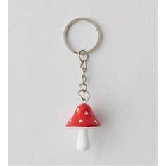 a red and white mushroom shaped key chain