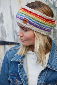 Rainbow stripes with an OOAK twist. This headband will brighten up any winter day!This stunning women's hand knitted wool headband and ear warmer is handmade in Nepal using fair trade practices, and decorated with eye-catching patterns. An accessory that's sure to keep you cozy and in fashion this season!100%WoolFleece linedFair Trade and Handmade in Nepal Machine wool wash max 30 degrees or cool handwash. Short spin. Dry flat. Do not tumble dry. Knitted Rainbow, Hand Knit Headband, Rainbow Headband, Festival Headband, Knitted Headband, Handmade Fair, Knit Headband, Wool Wash, Retro Rainbow