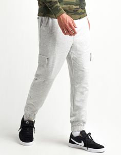 RSQ Fleece Cargo Jogger Sweatpants. Solid fleece jogger sweatpants. Elastic drawstring waist. Slant hand pockets. Velcro cargo pockets at sides. Back right welt pocket with RSQ label. Approx. outseam: 42". 58% cotton/37% recycled polyester/5% spandex. Machine wash. Imported. Urban Style Cargo Pants For Jogging, Urban Style Fleece Sweats With Pockets, Urban Fleece Sweats With Pockets, Urban Style Sports Joggers With Hip Pockets, Urban Sweatpants With Pockets For Jogging, Urban Style Sweatpants With Pockets For Jogging, Urban Joggers With Hip Pockets For Sports, Urban Joggers For Sports, Leisure Fleece Joggers With Pockets