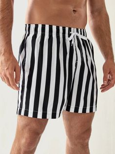 Our Striped Pattern Drawstring Waist Swim Shorts are perfect for stylish summer wear. Featuring a stylish striped pattern, these shorts offer a fashionable and lively look. An adjustable drawstring waist ensures a snug and secure fit, providing you with distraction-free comfort while swimming. Details: Pattern Type: Striped Details: Drawstring, Pocket Type: Bottoms Bottom Type: Shorts Fabric: Slight Stretch Composition: 100% Polyester Care Instructions: Machine wash, do not dry clean, wash with Striped Cotton Swim Trunks For Beach Season, Trendy Striped Shorts With Built-in Shorts, Striped Shorts With Elastic Waistband For Summer, Striped Summer Shorts With Elastic Waistband, Striped Drawstring Bottoms For Beach, Striped Cotton Swim Trunks For Beach, Striped Beach Bottoms With Drawstring, Striped Cotton Swim Trunks For Summer, Striped Swim Trunks With Elastic Waistband For Summer