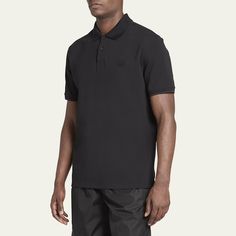 Moncler solid polo shirt Spread collar; two-button placket Tonal rubber logo patch Cuffed short sleeves Pullover style Cotton Unlined Professional cleaning recommended Imported Black Polo Collar T-shirt With Moisture-wicking, Luxury Garment-dyed Men's T-shirt, Moncler T Shirt, Black Moisture-wicking Polo Collar T-shirt, Black Moisture-wicking Polo T-shirt, Man Logo, Cuffed Shorts, Short Sleeve Pullover, Professional Cleaning