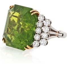 Indulge in the captivating allure of the Platinum & 18K Yellow Gold 45 Carat Large Peridot Diamond Ring. This exquisite piece is a celebration of strength, symbolized by the August birthstone, peridot. Legend has it that the green peridot crystals, found in the ashes of volcanic eruptions, were once believed to be the tears of the volcano goddess, Pele. Adorned with a vibrant emerald-cut peridot gemstone, this ring emanates a brilliant green hue that enchants the eye.Crafted with meticulous atte Goddess Pele, Volcano Goddess, Emerald Birthstone, Peridot Crystal, August Birthstone, Peridot Gemstone, Tennis Necklace, Green Peridot, Platinum Ring