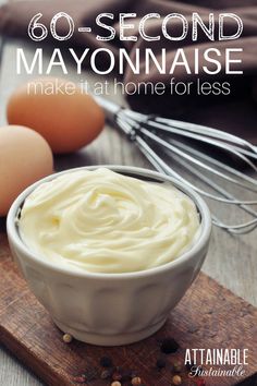 a bowl filled with mayonnaise next to eggs