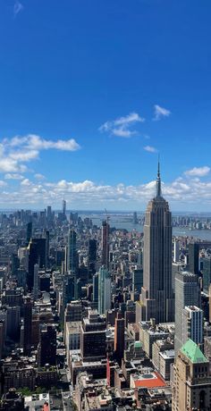 an aerial view of new york city with the empire building in the foreground