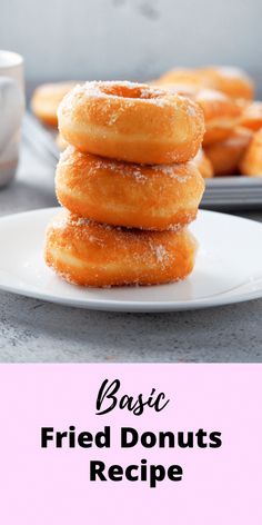 a stack of doughnuts sitting on top of a white plate