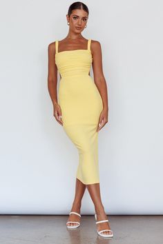 Lemon color midi dress Partially Lined Stretchy, ribbed fabric Elasticated straps Lace-up back Side split Zipper in back You'll be breaking hearts in our super hot Dream Crush midi dress. We are in love with the stretchy, ribbed fabric and sexy, strappy back. Perfect for rooftop cocktails at your fave bar with your fave girls. Team it with mules and a tote for a look that'll get all the attention. MODEL INFO Model is wearing size XS Height: 5'7" Bust: 34" Waist: 24" Hips: 34" GARMENT INFO Flat g Lemon Color Dress, Lemon Color, Hoco Dress, Yellow Bridesmaids, Yellow Midi Dress, Blue Bridesmaids, Date Night Dresses, Clothing Tags, Mini Dress Casual