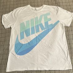 Nike T-Shirt Xxl White & Blue Athletic Cut 100% Cotton Nwot Never Worn Pit To Pit 24” Top To Bottom 30” Light Blue Cotton T-shirt With Logo Print, Light Blue Logo Print Crew Neck T-shirt, Light Blue Crew Neck T-shirt With Logo, Casual Light Blue T-shirt With Logo Print, Casual Light Blue T-shirt With Logo, Nike Blue Crew Neck T-shirt, Nike Light Blue Crew Neck T-shirt, Light Blue Casual Sports T-shirt, Casual Light Blue T-shirt For Sports