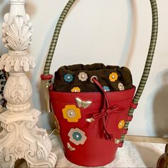 Listing Is For A Very Rare Piece Of Functional Art By Renowned Designer Barry Kieselstein Cord The Bag Is Designed To Resemble A Flower Pot Complete With A Garden Like Hose As The Strap, Butterflies And Flowers The Purse Has Always Been Displayed Like Art Inside My Home And Never Used As All Rare Art Collectors Know Unique Designer Pieces Such As This Just Keep Going Up In Price Sky’s The Limit The Leather Bag Has The Designers Plate Inside And The Made In Italy It Also Comes With The Iconic Moo Vintage Flower Pots, Unique Designers, Functional Art, Vintage Bags, Art Collector, Vintage Flowers, Flower Pots, Leather Bag, Top Handle Bag