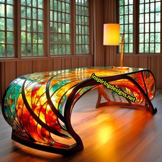 an artistic bench made out of stained glass in a room with wooden floors and large windows