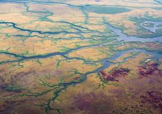 an aerial view of the land and water