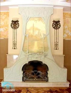 an ornate fireplace with two candles on each side