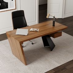 an office desk with a laptop on it in front of a painting and chair next to it