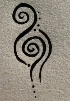 a black and white drawing of a swirly design on a piece of paper with dots