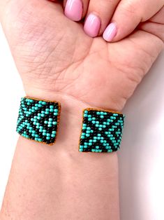 Made using genuine Guatemalan leather and exquisite glass beads, this cuff bracelet gives off an elegant and luxurious feel. Its unique patterns are brilliantly colored with strong Native American influences. Every piece in our collection is hand stitched with impeccable precision and detail. They are designed to make you feel bold and empowered! Flexible cuff fits all-sized adult wrists Band width measures approximately Handmade in Guatemala *Please note that all of our items are handcrafted an Unique Beaded Leather Bracelet As Gift, Adjustable Turquoise Cuff Bracelet As Gift, Adjustable Cuff Beaded Bracelets As Gift, Beaded Cuff Bracelets As Gift, Beaded Leather Bracelet For Gift, Beaded Cuff Bracelets For Gift, Turquoise Cuff Bracelet With Round Beads As Gift, Beaded Cuff Bracelet As Gift, Unique Cuff Beaded Bracelets For Gifts