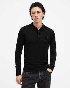 Blend casual and formal styling with the Mode Merino Polo. Made from soft merino wool, it features a three-button placket and our hallmark Ramskull embroidered on the chest. Pub nights or busy days out? Give it a go, it's the perfect base layer for seasonal styling.   This polo is designed to a slim fit Classic collar Ribbed trims Long sleeves Three-button placket Ramskull embroidery Allsaints Classic Long Sleeve Top, Classic Long Sleeve Allsaints Tops, Long Sleeve Polo Shirt With Buttons For Work, Fitted Long Sleeve Polo Shirt With Buttons, Fitted Long Sleeve Polo Shirt For Formal Occasions, Long Sleeve Polo Shirt For Fall With Button Closure, Casual Long Sleeve Polo Sweater For Business, Fall Long Sleeve Polo Shirt With Button Closure, Casual Merino Wool Polo Shirt For Workwear