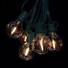 string lights with clear bulbs on black background