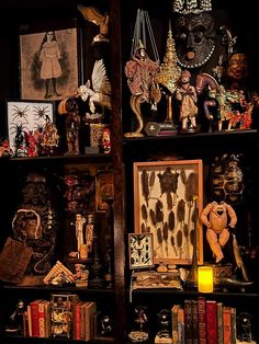 a book shelf filled with lots of books and figurines