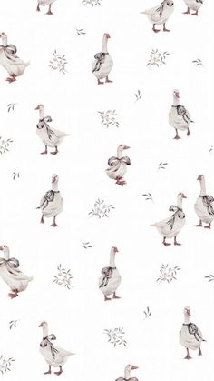 a flock of birds standing next to each other on a white wallpaper covered floor