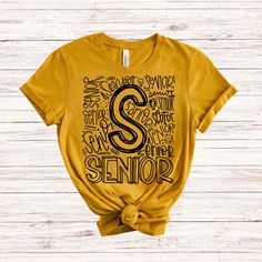 This Senior Typography Assorted Colors Tee is a great addition to your spirit wear collection. Also available in assorted colors and many different grade levels, it's perfect for sporting your school pride. Get one today! Click here for Senior primary colors listing. Back To School Sales, School Pride, School Events, Teacher Tees, Spirit Wear, Craft Shop, Second Grade, Tee Design, Teacher Shirts