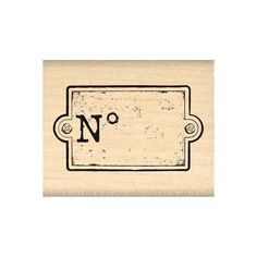 a rubber stamp with the letter n on it's front and bottom corner, in black ink