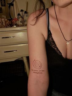 a woman with a tattoo on her arm