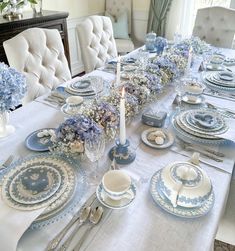 the table is set with blue and white china