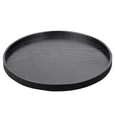 an empty black plate on a white background