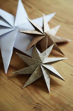 an origami star sitting on top of a wooden table