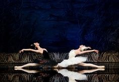 two ballerinas in white tutu and black leotards