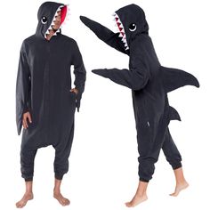 two people in shark onesuits standing next to each other with their mouths open