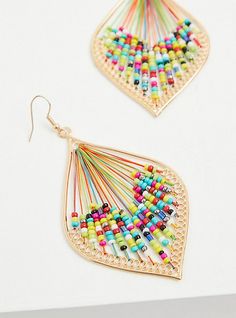 These threaded teardrop earrings feature colorful beads to create a one-of-a-kind design. French hook. Base metal. Imported. The best plus size women's gold-tone & multi bead threaded teardrop earrings in multi. Torrid is your destination for cozy fall and winter clothes to keep you warm and comfortable. Trendy Gold Beaded Earrings With Dangling Beads, Gold Teardrop Jewelry With Colorful Beads, Beaded Teardrop Earrings For Summer, Summer Beaded Teardrop Earrings, Summer Teardrop Beaded Earrings, Multicolor Gold Beaded Summer Jewelry, Multicolor Gold Beads Jewelry For Summer, Multicolor Gold Beaded Jewelry For Summer, Multicolor Metal Earrings With Dangling Beads