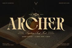 an open book with the word archer written in white and on top of it are two oranges