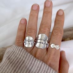 100% Handmade and personalized for you. Custom coordinate Ring lets you carry that unforgettable place that shaped your life journey with you everyday. This listing is for ONE coordinate ring For Date Ring is here https://www.etsy.com/listing/790742697 For Bubble Initial Ring is here https://www.etsy.com/listing/776803276 Details - Made of solid sterling silver - Disc measures 22mm - Band width measures approximately 17gauge ❥ If you have any questions, please contact me vis Etsy convo ❥ Please Customizable Engraved Adjustable Round Ring, Modern Personalized Stackable Rings For Everyday, Personalized Adjustable Rings For Everyday, Modern Personalized Everyday Stackable Rings, Personalized Silver Ring With Meaningful Style, Customizable Adjustable Rings For Promise, Adjustable Hand Stamped Initial Ring For Gift, Adjustable Customizable Rings For Promise, Meaningful Adjustable Open Ring