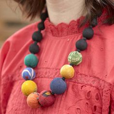 A constellation of colorful repurposed Kantha beads brightens up a background of black beads, representative of the night sky. Sustainably handmade by women artisans in India. Handmade Black Jewelry For Festivals, Festive Handmade Black Necklace, Handmade Black Necklaces For Festivals, Handmade Black Necklace For Festivals, Black Beads For Festivals Gift, Fair Trade Black Jewelry For Festival, Black Fair Trade Jewelry For Festivals, Black Artisan Beaded Chain Jewelry, Artisan Black Beaded Chain Jewelry