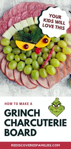 the grinch charcuterie board has grapes and cheese on it