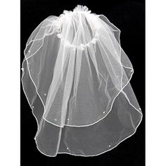 a white veil on top of a black background