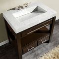 a white sink sitting on top of a wooden cabinet next to a wall mounted mirror