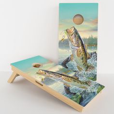 a cornhole board with two fish jumping out of the water to catch a fish