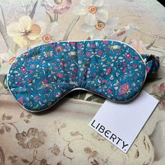 This is a pretty little sleep mask by Liberty of London. Classic design in tana lawn cotton fabric with elasticated band. The fabric pattern features pretty flowers and elephants.  Soft, clean and comfortable. Unworn with tags. 🎁Please note that all boxes are for photographic purposes only and are not included in the sale🎁 Sadly, I am unable to send items to Germany. This is due to the fact that new packaging laws were introduced there last year and I am not registered to sell and dispatch ite Sleep Masks, Special Delivery, Liberty Of London, Sleep Mask, Fabric Patterns, Royal Mail, Classic Design, Animal Print, Etsy Seller