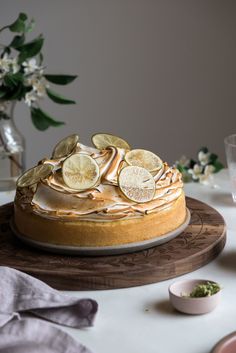 a cake sitting on top of a wooden platter