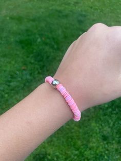 This Bracelet is a favortie from our team! Its a very beautiful bracelet made from a disco ball charm and varietys of pink clay beads! Pink Stretch Bracelet With Spacer Beads For Friendship, Pink Round Beaded Bracelets With Spacer Beads, Pink Beaded Bracelets With Round Polymer Clay Beads, Pink Clay Bead Necklace, Pink And White Clay Bead Bracelet, Adjustable Pink Beaded Polymer Clay Bracelet, Pink Polymer Clay Bracelet With Colorful Beads, Clay Beads Bracelet, Pink Disco