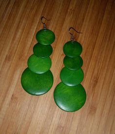 "Green Wooden Earrings. High Quality & Comfort Fit. Lightweight Dangle Earrings. Handmade Ethnic Design Length: 3\"&3/4\" Inches FAST SHIPPING! Visit my Etsy Shop to see more Designs! Handmade Earrings, Bracelets and Necklace https://www.etsy.com/shop/FreedomLifeStyle" Adjustable Green Drop Plug Earrings, Elegant Green Circular Earrings, Green Dangle Earrings For Pierced Ears, Unique Green Dangle Earrings, Green Chandelier Earrings With Pierced Ears, Green Round Chandelier Earrings As Gift, Green Round Chandelier Earrings For Gift, Bohemian Green Circular Earrings, Green Bohemian Circle Earrings